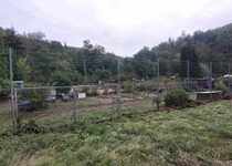 Přistavení kontejnerů k ukládání odpadu v lokalitě zahrádky u tenisových kurtů – úklid po povodních